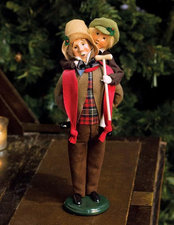 Bob Cratchit and Tiny Tim carollers